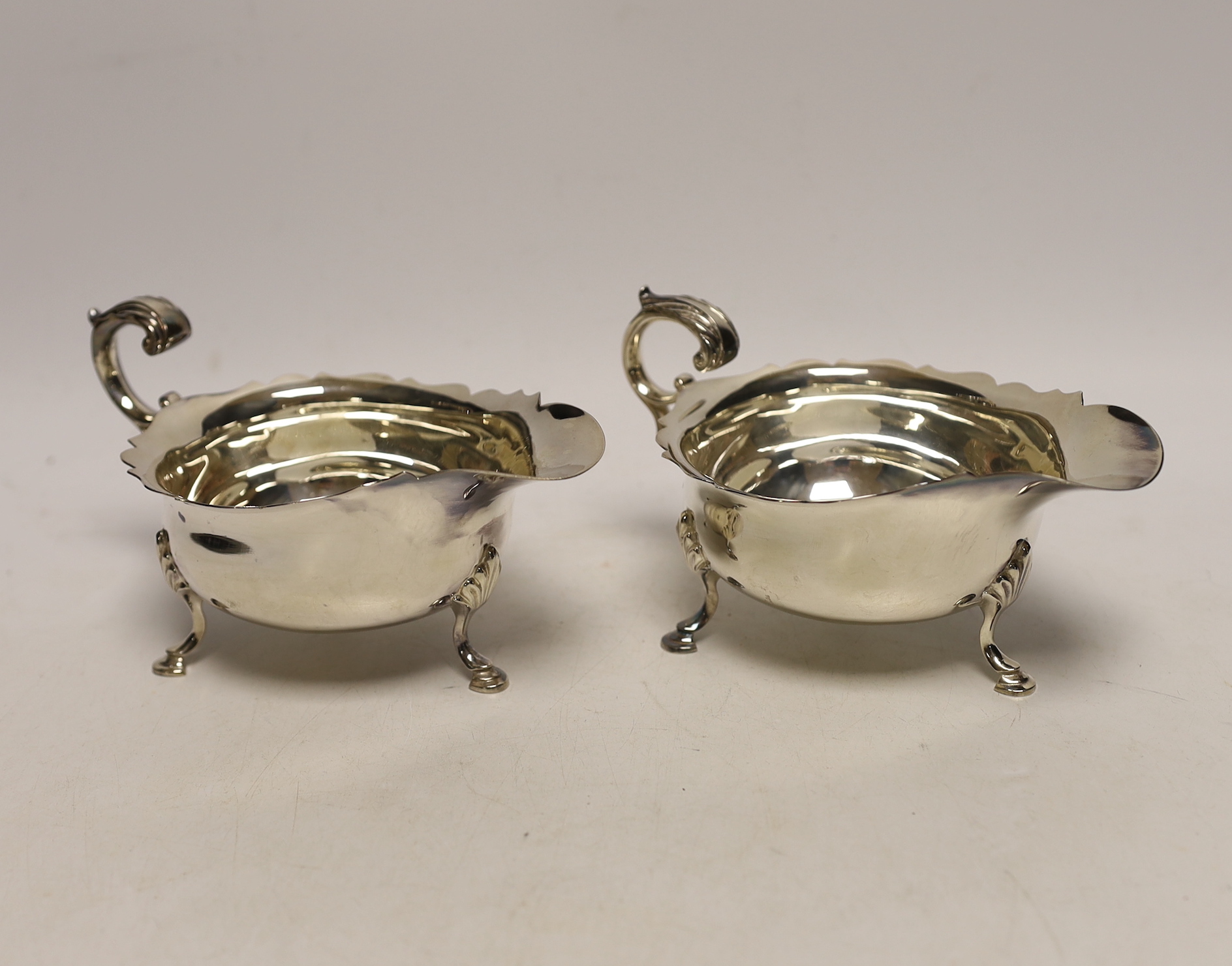 A modern pair of silver sauceboats, C.J. Vander Ltd, Sheffield, 1990, length 15.2cm, 9.7oz.